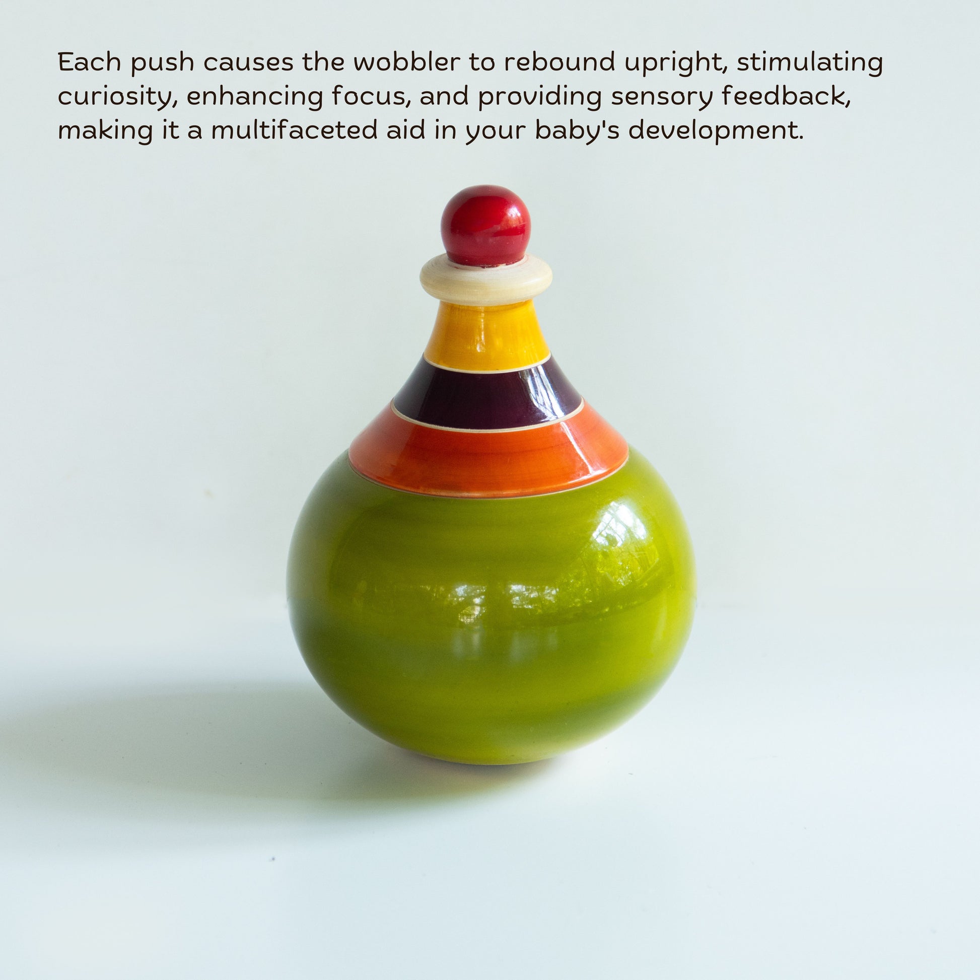 Handcrafted Wooden Globe Wobbler with rounded shape for baby sensory play and visual tracking.