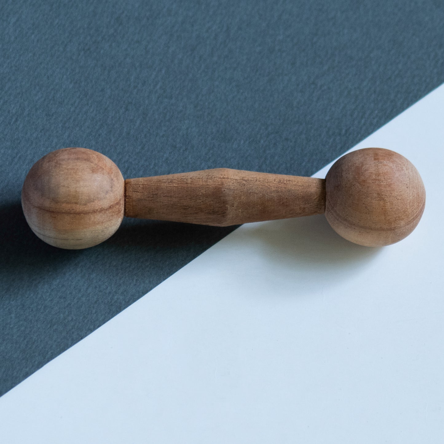 Close-up of Wooden Dumbbell Teether from The Toy Trunk – handmade, eco-friendly, Montessori-inspired toy for babies and toddlers