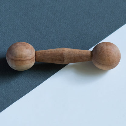 Close-up of Wooden Dumbbell Teether from The Toy Trunk – handmade, eco-friendly, Montessori-inspired toy for babies and toddlers