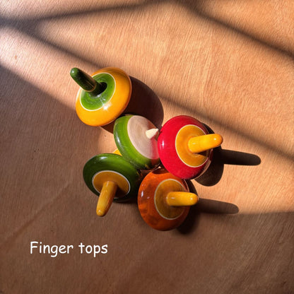 Colourful wooden finger spinning tops, also known as traditional lattu toys.