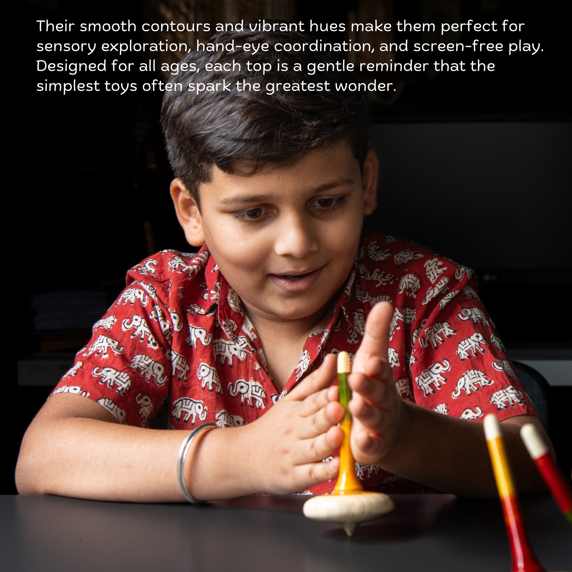 Child playing with handmade wooden spinning top for screen-free skill play.