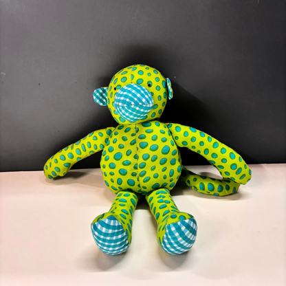 Mimi Monkey handmade cotton soft toy in lime and teal spotted handblock print.