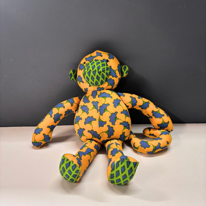 Mimi Monkey cotton soft toy in orange and blue floral handblock print.