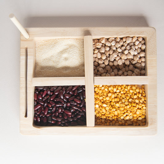 Montessori Wooden Tray and Sorter The Toy Trunk – top view of pincer tray with four compartments for sorting grains and sensory play