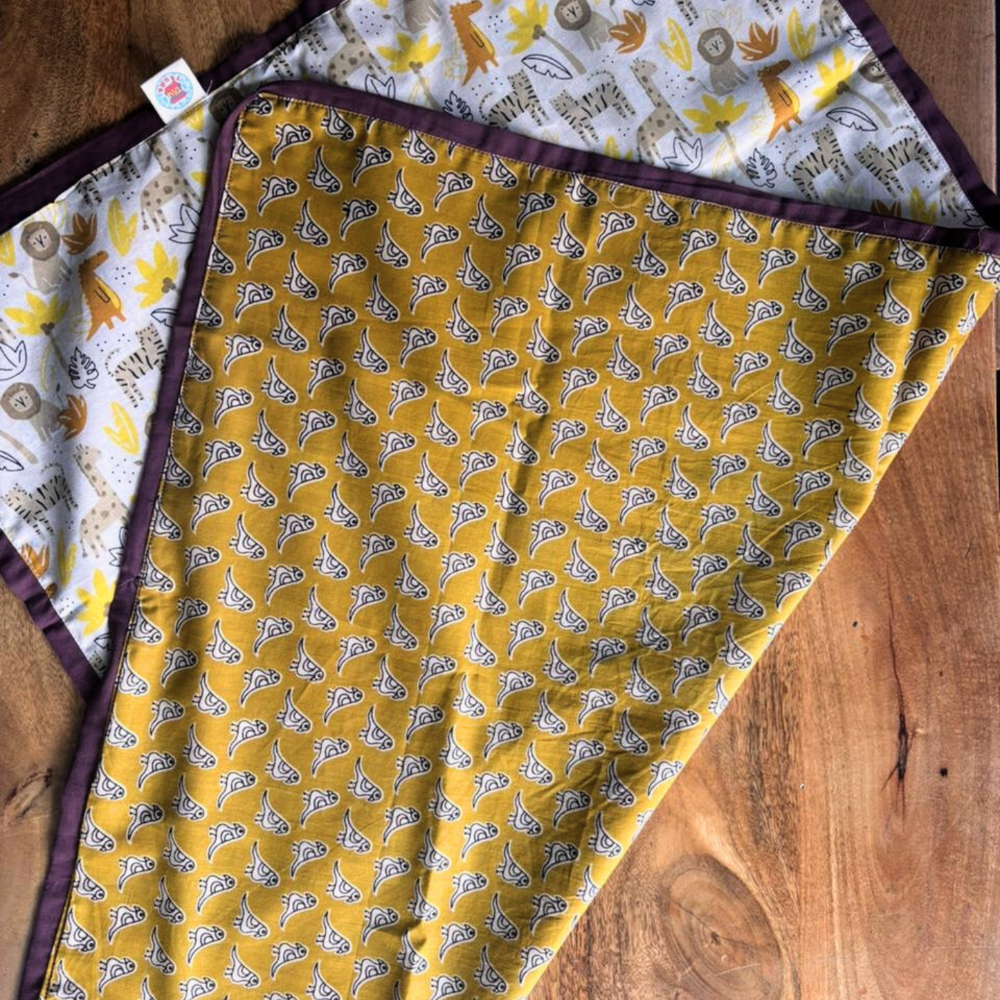 Cotton baby mat for tummy time and supervised rest in newborn gift set.