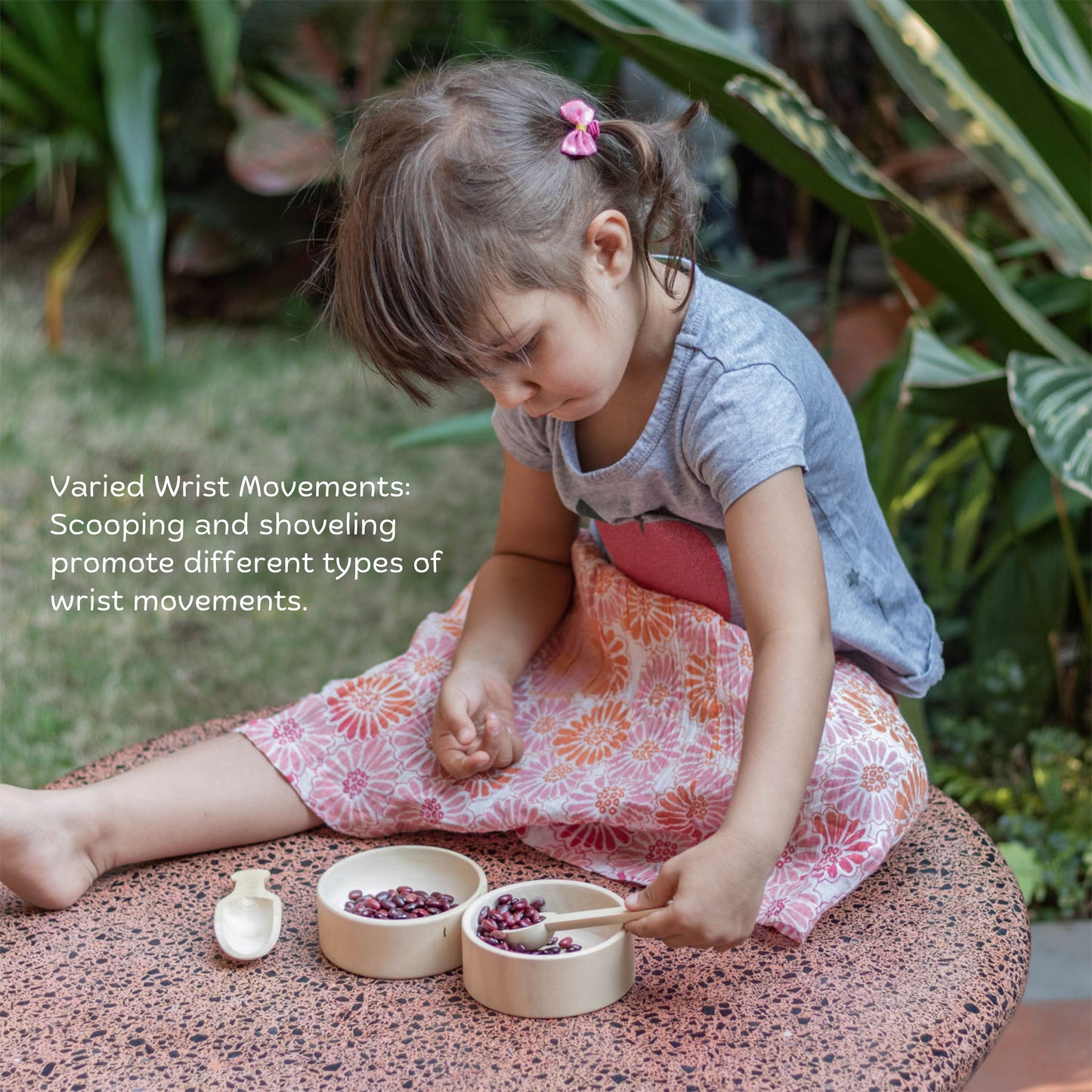 Toddler enjoying Wooden Montessori Bowls – safe, eco-friendly handmade wooden toy promoting sensory play, dexterity, and hand-eye coordination