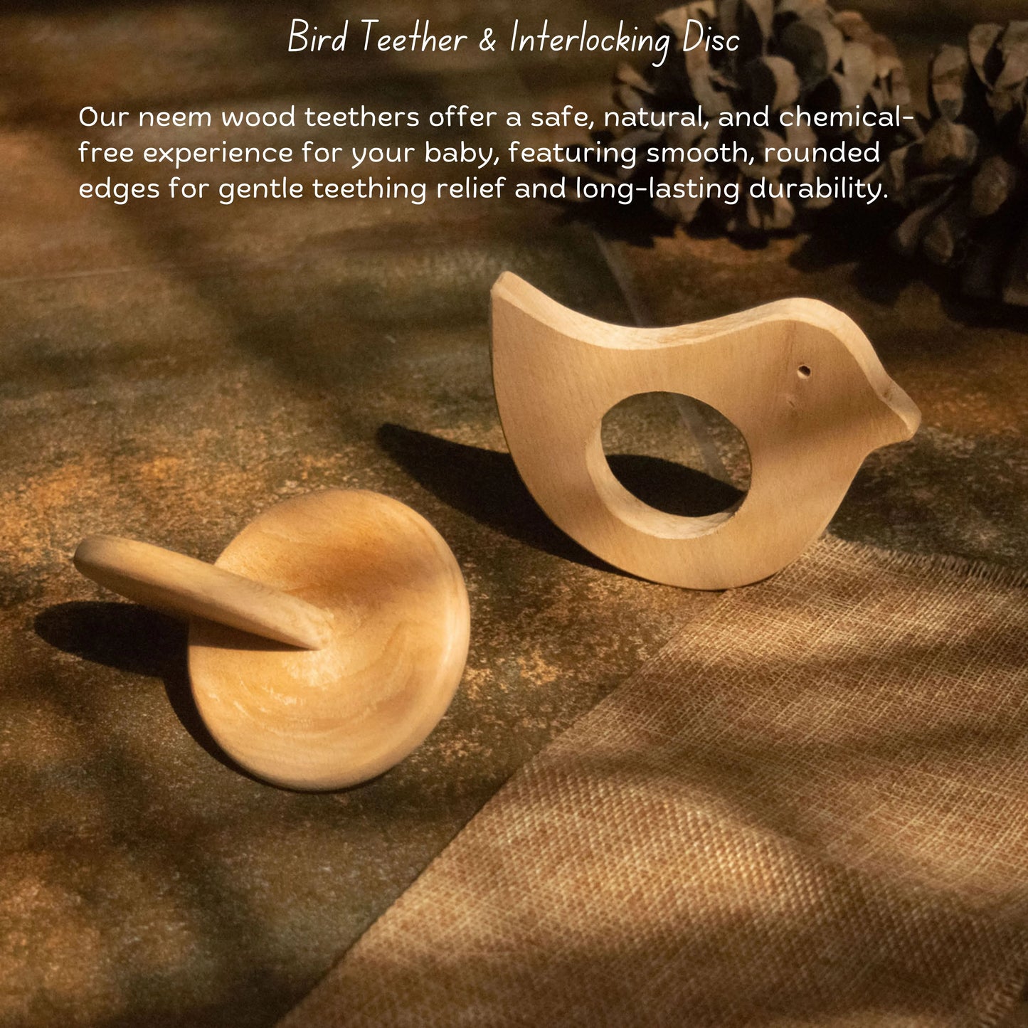 Wooden bird teether and interlocking discs set by The Toy Trunk, displayed on a natural neem wood background.