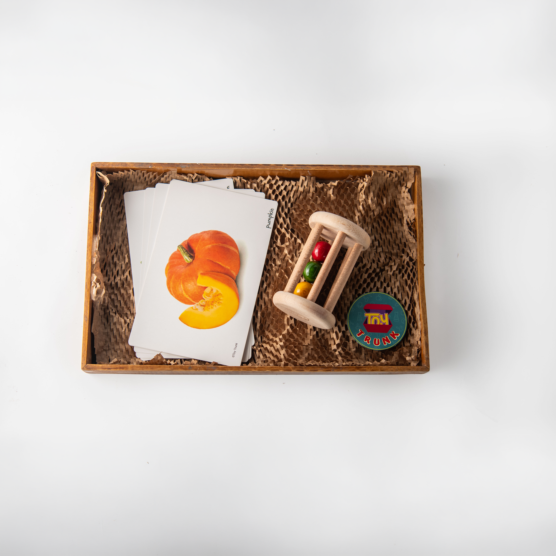 Wooden Roll & Learn Set with rolling rattle and vegetable flash cards for toddlers.