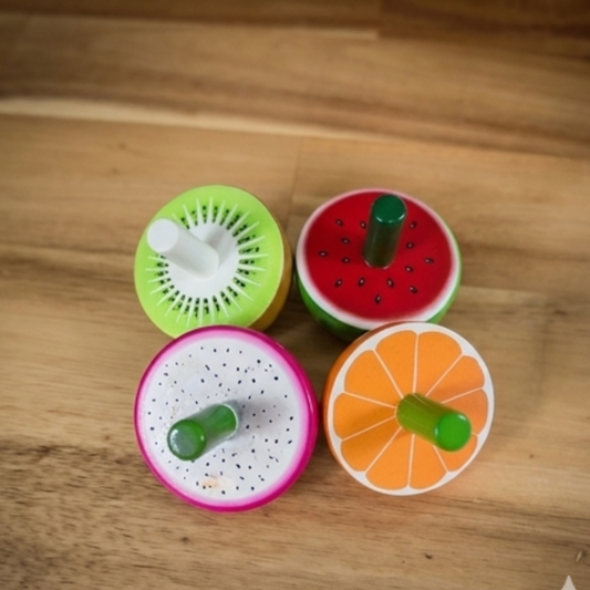 Wooden Fruit Spinning Tops Set of 4 with kiwi, watermelon, dragon fruit and orange designs.