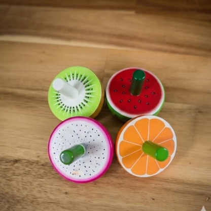 Wooden Fruit Spinning Tops Set of 4 with kiwi, watermelon, dragon fruit and orange designs.