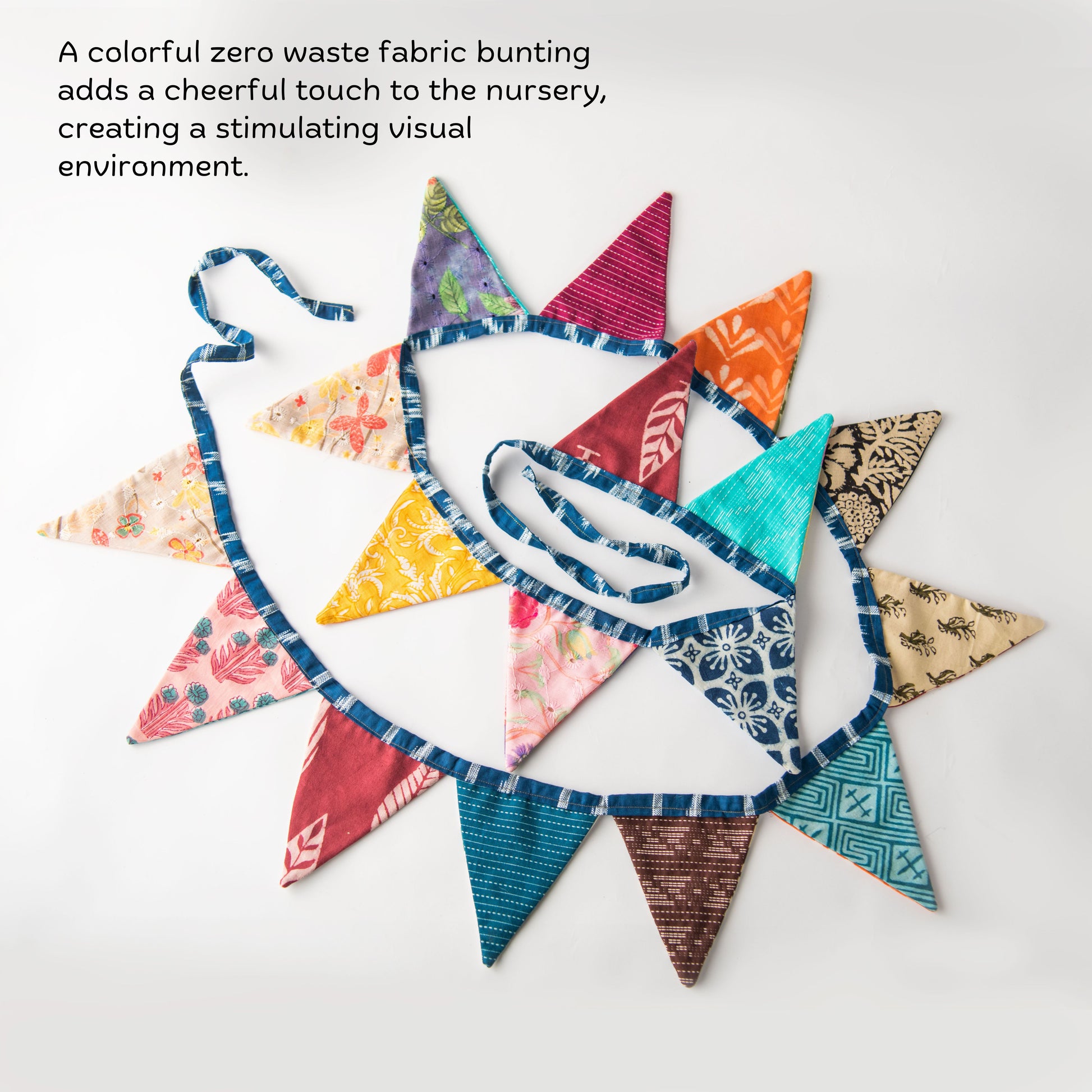 Fabric bunting banner for toddler room décor and sensory colour play.