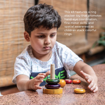 Wooden Learn and Stack Discovery Kit The Toy Trunk – toddler playing with ring stacker to improve hand-eye coordination and motor skills