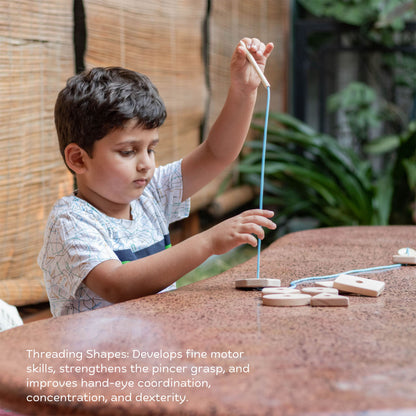 Child playing with Wooden Mini Montessori Starter Box for threading and fine motor skills.