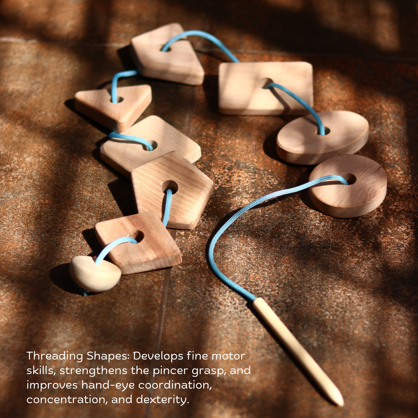 Mini Montessori Box with wooden threading shapes and spoon for toddler learning.
