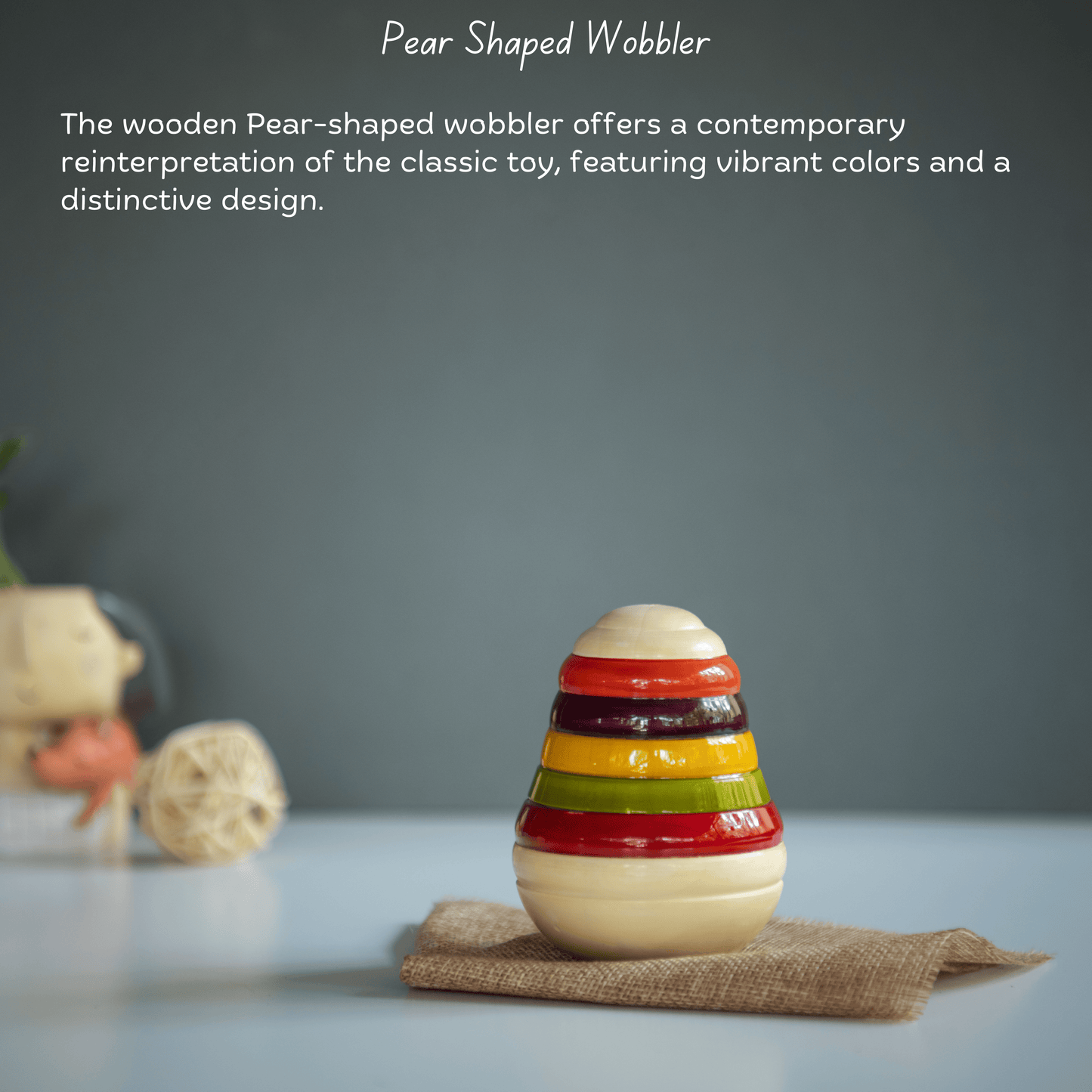 Handcrafted Wooden Pear Wobbler toy for babies, supporting sensory play and movement.
