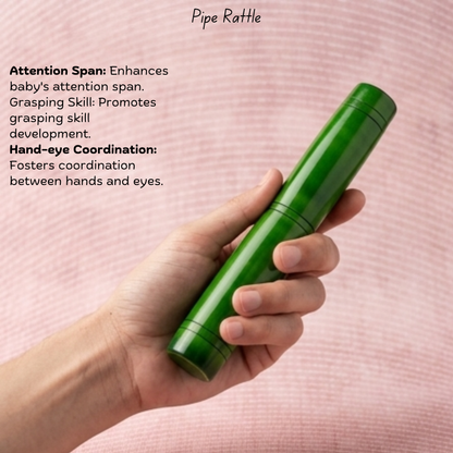 Baby-safe wooden pipe rattle showing easy-grip shape for grasping and hand-eye coordination.
