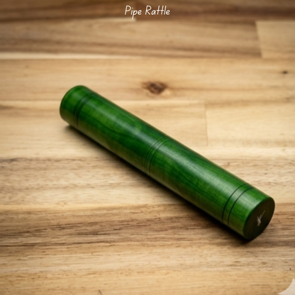 Wooden Channapatna-style pipe rattle for babies with green lacquer finish and non-toxic coating.