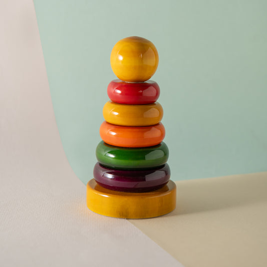 Montessori wooden ring stacker for colour recognition, size sequencing and motor skills.