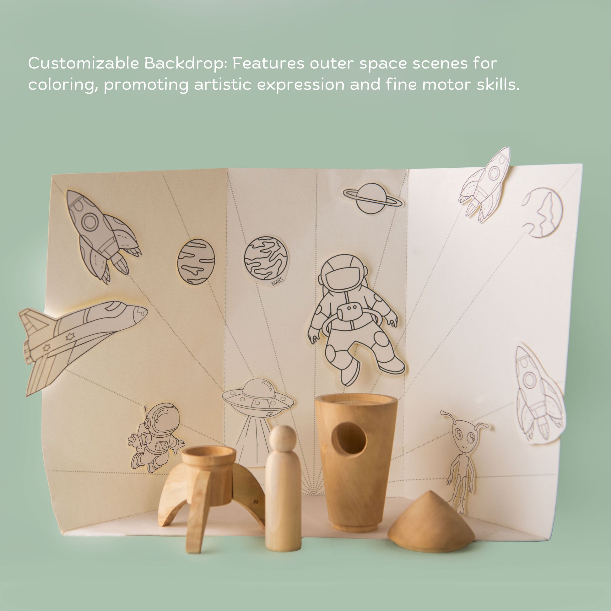 Paper cutouts of astronauts, aliens, and rockets included with Wooden Space Adventure Rocket DIY STEM toy