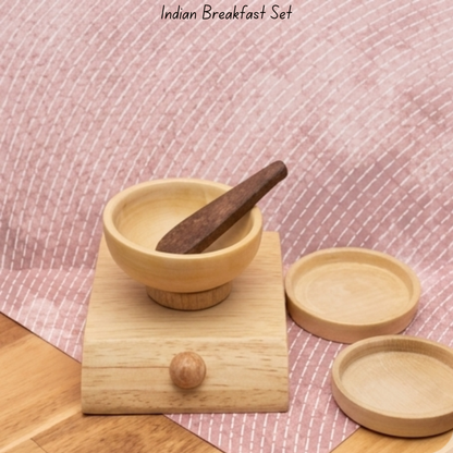Close-up of wooden toy mortar and pestle from Indian breakfast pretend play set.